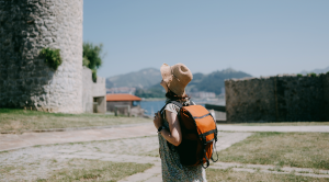 Woman by church of Santa María de la Asunción, Camino de Santiago, Spain 